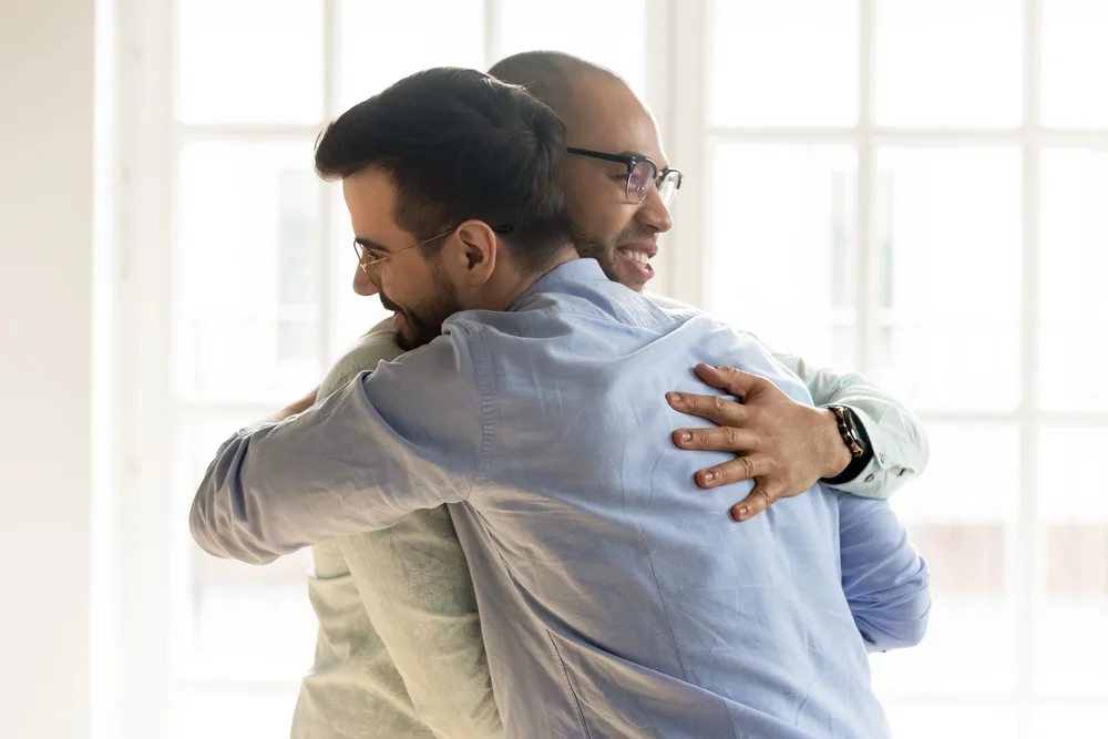Two Males Hugging